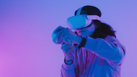 Gamer playing a VR shooting game