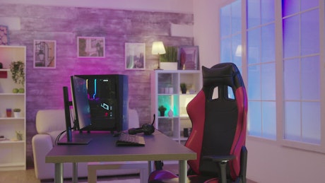 Gaming chair and PC in colorful home office.