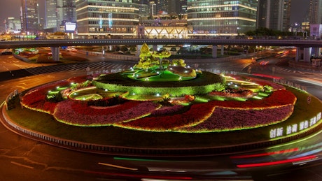 Gazebo with a garden in the city of Shanghai at night.