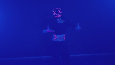 Girl dancing with party lights in front of the camera