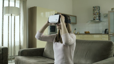 Girl exploring in virtual reality.