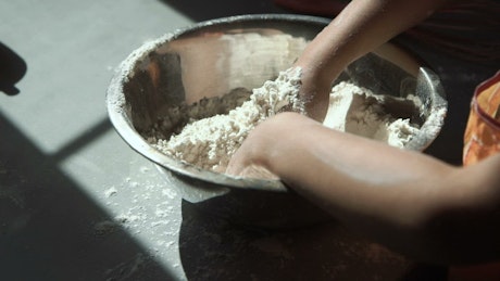 Girl hands preparing the dough