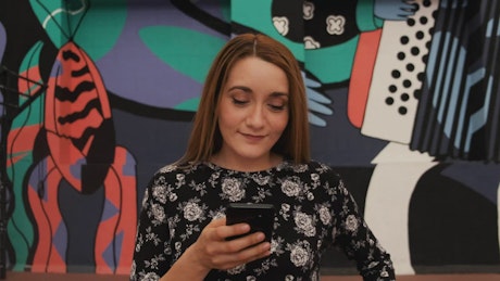 Girl looking at the likes in her post.
