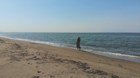 Girl walking in the seashore