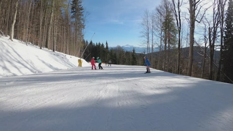 Going down the ski track in the mountain.