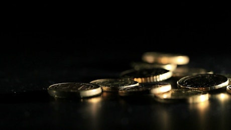 Gold coins on a table.