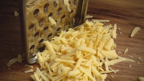 Grating cheese, close up.