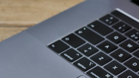 Gray laptop keyboard close up.