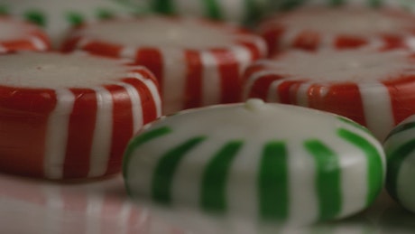 Green and red candies slowly rotating.