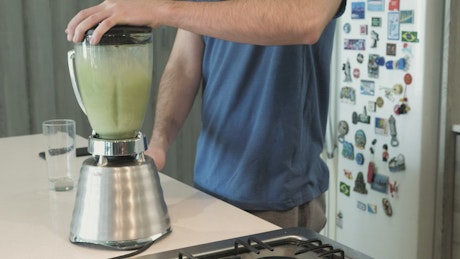 Green juice in blender.