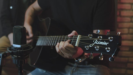 Guitarist performing with an accoustic guitar