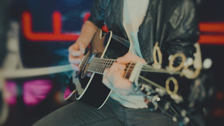 Guy playing an acoustic guitar.