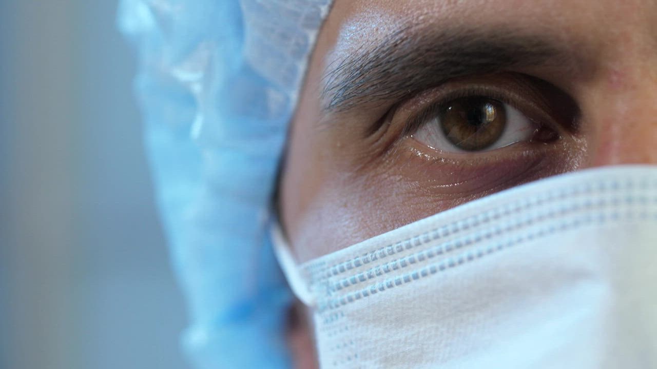 Half face of a doctor wearing mask - Free Stock Video