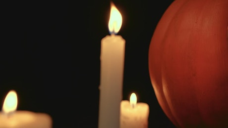 Halloween pumpkin and candles at night