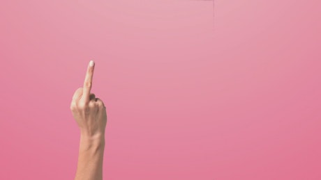 Hand rising with it's middle finger raised against a pink background.