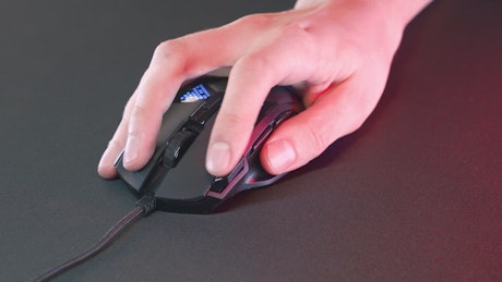 Hand using a gaming mouse.