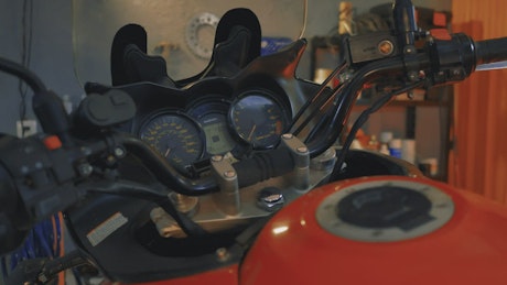 Handlebars of a motorcycle in a mechanical workshop