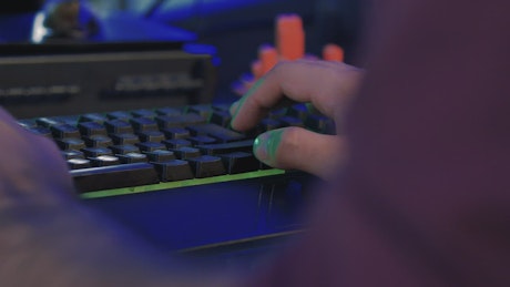 Hands of a programmer typing on a keyboard.