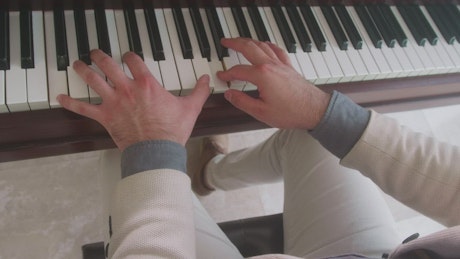 Hands of a talented pianist playing