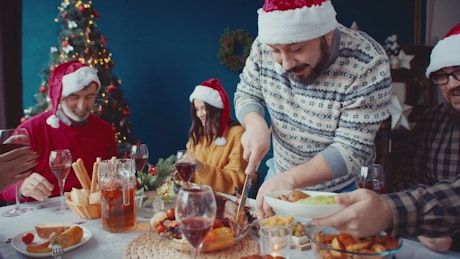 Happy family enjoying a Christmas feast together.