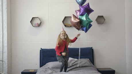 Happy girl with balloons