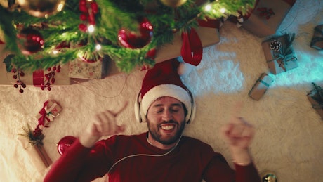 Happy man dances because Christmas is approaching.