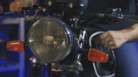 Headlight of a motorcycle that is turned on by a person