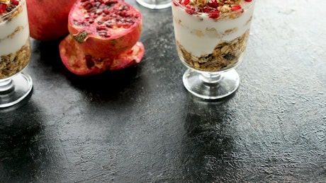Healthy foods diet yogurt and muesli with pomegranates.