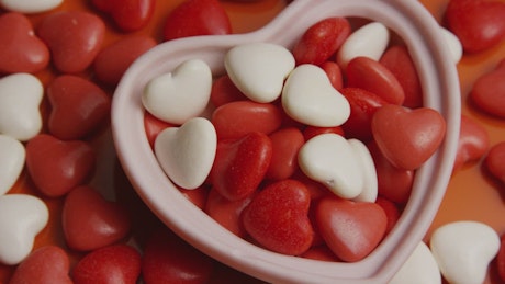 Heart shaped candy in white and red color