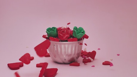 Hearts and roses of candy in flower pot.