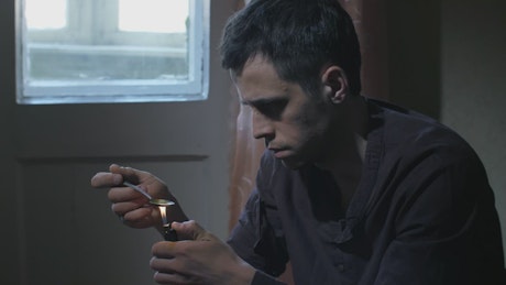 Heroin addict preparing a dose