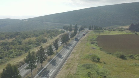 Highway crossing through nature in an aerial view.