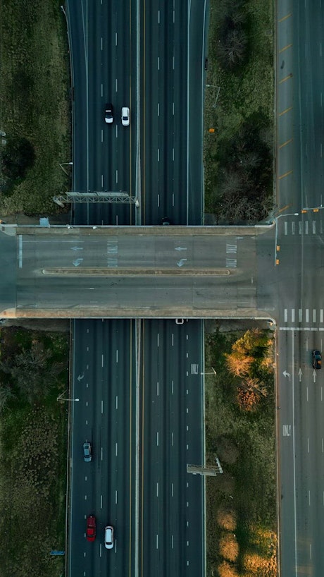 Highway with cars in an overhead aerial view.