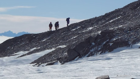 Hikers on a snowy mountain