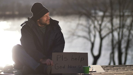 Homeless man asking for help.