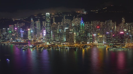 Hong Kong motion at night, far aerial shot.