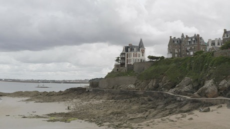 Houses on the edge of a coastal cliff