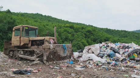 Huge loader abandoned in a garbage dump.
