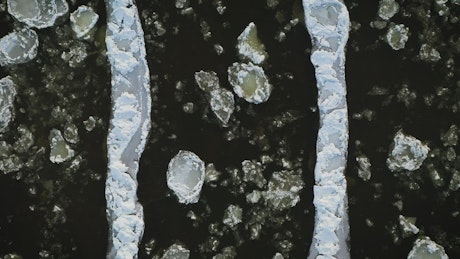 Ice floes in river filmed from above.