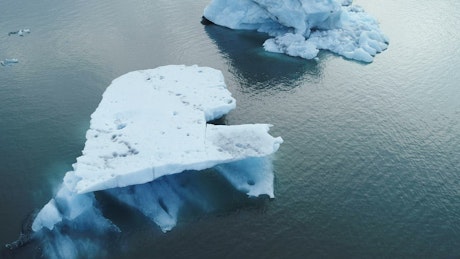 Icebergs floating in the ocean.