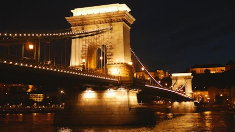 Illuminated bridge at night.