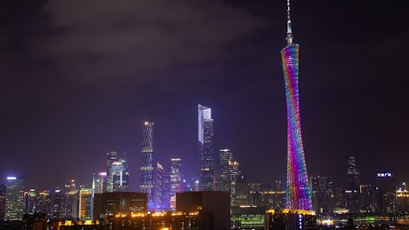 Illuminated Guangzhou TV tower at night.