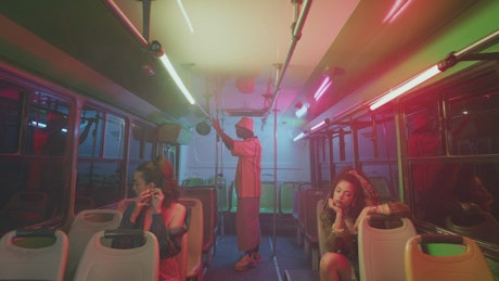 Inside a bus with a few people