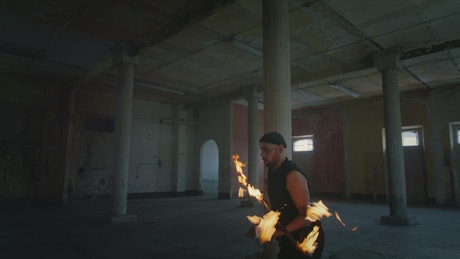 Juggler doing flashy tricks with fire