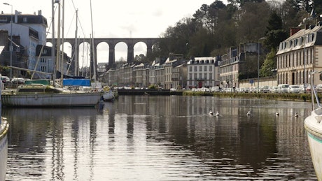 Landscape of bridge, buildings, boats and canal
