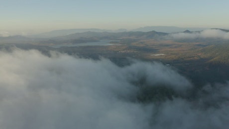 Landscape seen from above covered by mist.