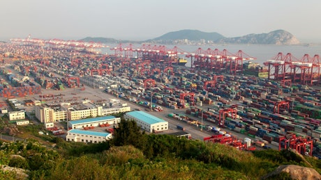 Large cargo warehouse area on a shoreline.