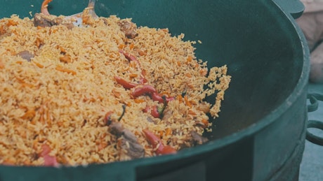Large casserole cooking rice.