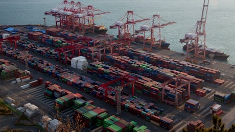 Large container area on a cargo ship shoreline, aerial view.