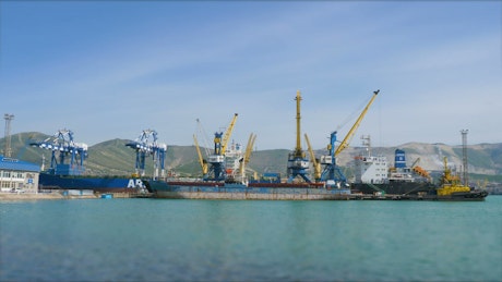 Large container ships with cranes in the commercial port Novorossiysk.